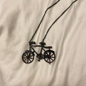 Vintage bicycle necklace on a long chain